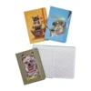 Cuatro cuadernos-agenda 'Perritos Trendy' apilados, con uno abierto revelando sus páginas cuadriculadas perfectas para organización, y el cierre de caucho.